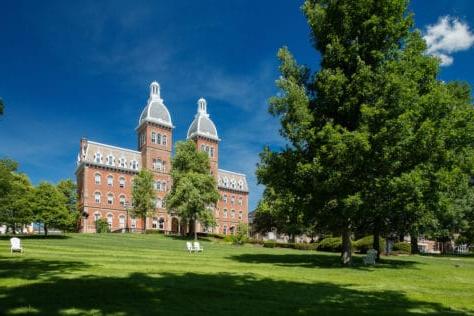 Photo of Old Main taken from the corner of College and East Wheeling streets.